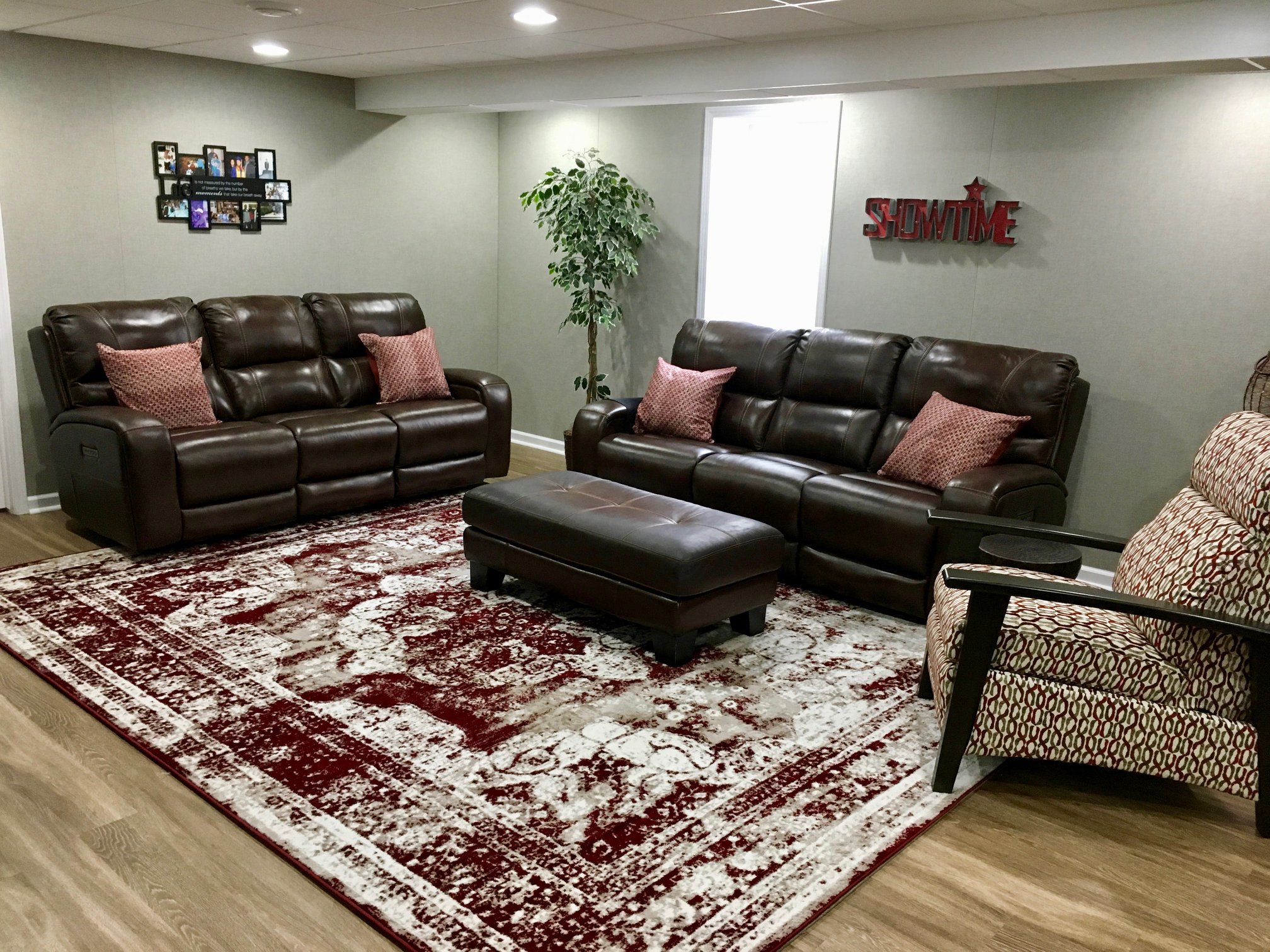 a living room filled with furniture and a rug